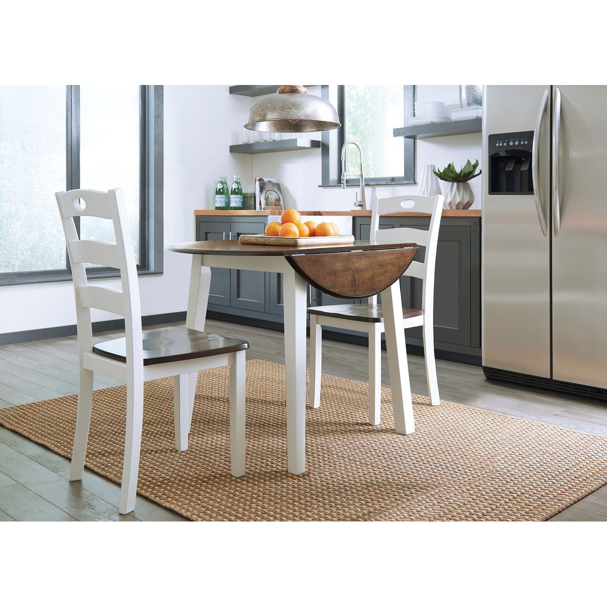 dd619d662eda207b52a8bcf9c13fcbe0 Woodanville - 3 Pc. - Drop Leaf Table, 2 Side Chairs - Cream / Brown - Image 1