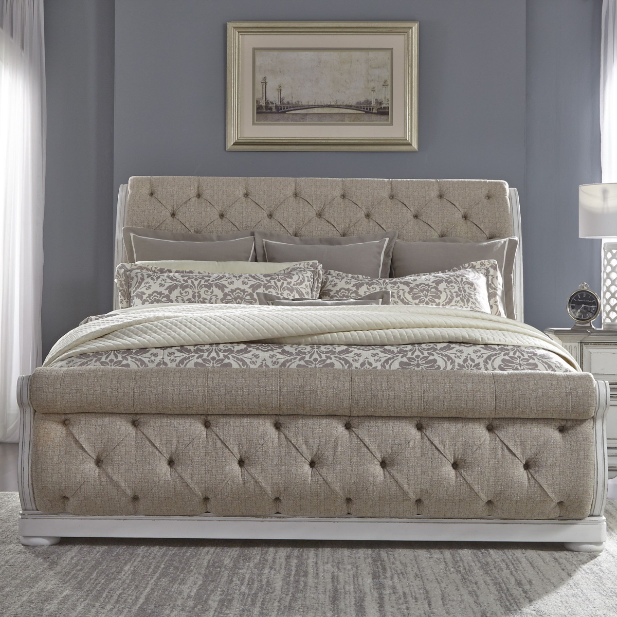 bb993fa1b43054714c40964f5b7d6b6f Abbey Park - King Upholstered Sleigh Bed - White - Image 1