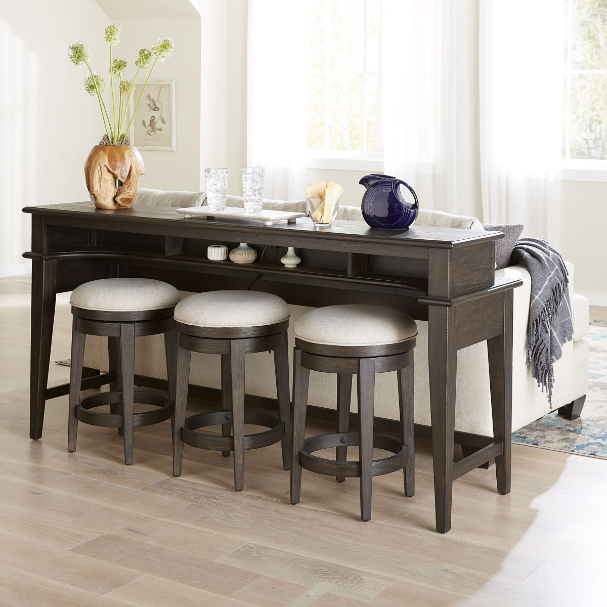 e60e03456ec958bcafed1f471b2a8e5c Mill Creek - 4 Piece Console Set (Bar Console & 3 Stools) - Dark Brown - Image 1